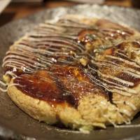 <em>Okonomiyaki</em> is a popular dish from Osaka, a city known for its hearty, down to earth cuisine. | MAKIKO ITOH