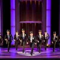 Top class: Jerry Travers (played by Alan Burkitt, center) leads the male chorus in synchronized style. 'Top Hat' musical takes film classic to happy new heights