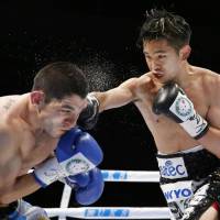 Kazuto Ioka lands a punch on Argentina\'s Roberto Domingo Sosa during their WBA flyweight title bout in Osaka on Sunday. | KYODO
