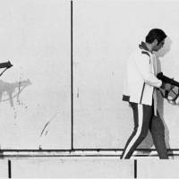 Two West German policemen wearing sweat suits and armed with machine guns get into position on the roof of the Munich Olympic Village building, on Sept. 5, 1972, as armed Arab commandos hold Israeli Olympic team members hostage. | AP