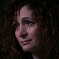 Oshrat Romano Kandell, daughter of Israeli Olympic weightlifter Yossef Romano, who was killed at the 1972 Munich Olympics, is seen during an emotional interview for the documentary \"Munich \'72 And Beyond.\" | COURTESY OF GLOBAL SPORTS DEVELOPMENT/DAVID ULICH