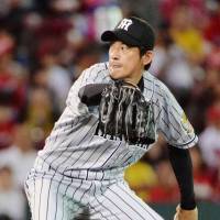 The Tigers\' Atsushi Nomi pitches against the Carp on Friday at Mazda Stadium. Nomi worked seven scoreless innings in Hanshin\'s 3-0 win over Hiroshima. | KYODO
