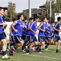 Japan\'s players go through their paces in Tehran on Sunday ahead of Tuesday\'s World Cup qualifier against Afghanistan. | KYODO