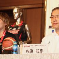 Japan captain Asami Yoshida speaks to the media as head coach Tomohide Utsumi listens at a news conference on Sunday. | KAZ NAGATSUKA