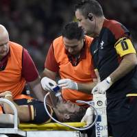 Leigh Halfpenny is given oxygen while being treated during Wales\' match against Italy on Saturday. | REUTERS