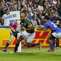 South Africa\'s JP Pietersen scores a try against Samoa on Saturday in Birmingham, England. | REUTERS