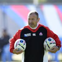 Brave Blossoms coach Eddie Jones, seen here during a training session on Monday in Warwick, England, is worried about the future of the sport in Japan. | AFP-JIJI