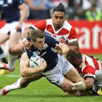 Scotland\'s Mark Bennett is tackled by Japan\'s Male Sa\'u and Michael Leitch (right) | REUTERS