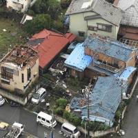Damaged homes in Chuo Ward, Chiba, are seen Monday after what the Meteorological Agency believes was a tornado hit Chiba Prefecture the day before. A total of 74 homes suffered roof damage and shattered windows in the cities of Chiba, Narita and Kamagaya. | KYODO