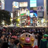 The horror: Halloween revelry peaked Saturday night in Japan and the area around Shibuya Station, in particular, saw a massive convergence of people decked out in a variety of costumes. | YOSHIAKI MIURA