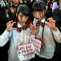 Open invitation: Halloween revelry peaked Saturday night in Japan and the area around Shibuya Station, in particular, saw a massive convergence of people decked out in a variety of costumes. | YOSHIAKI MIURA