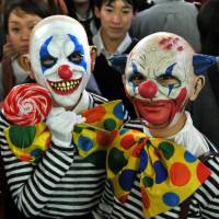 The stuff of nightmares: Halloween revelry peaked Saturday night in Japan and the area around Shibuya Station, in particular, saw a massive convergence of people decked out in a variety of costumes. | YOSHIAKI MIURA