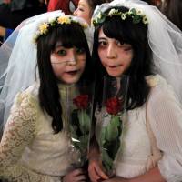 Brides forever: Halloween revelry peaked Saturday night in Japan and the area around Shibuya Station, in particular, saw a massive convergence of people decked out in a variety of costumes. | YOSHIAKI MIURA