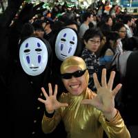 When worlds collide: The stuff of nightmares: Halloween revelry peaked Saturday night in Japan and the area around Shibuya Station, in particular, saw a massive convergence of people decked out in a variety of costumes. | YOSHIAKI MIURA