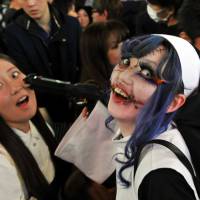All stitched up: The stuff of nightmares: Halloween revelry peaked Saturday night in Japan and the area around Shibuya Station, in particular, saw a massive convergence of people decked out in a variety of costumes. | YOSHIAKI MIURA