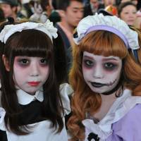 Maids from hell: The stuff of nightmares: Halloween revelry peaked Saturday night in Japan and the area around Shibuya Station, in particular, saw a massive convergence of people decked out in a variety of costumes. | YOSHIAKI MIURA