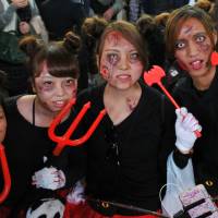 Devilish zombies: The stuff of nightmares: Halloween revelry peaked Saturday night in Japan and the area around Shibuya Station, in particular, saw a massive convergence of people decked out in a variety of costumes. | YOSHIAKI MIURA