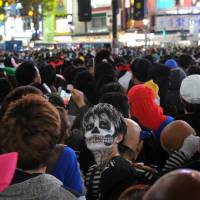 Cross if you dare: The stuff of nightmares: Halloween revelry peaked Saturday night in Japan and the area around Shibuya Station, in particular, saw a massive convergence of people decked out in a variety of costumes. | YOSHIAKI MIURA