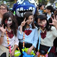 Watch your back: Halloween revelry peaked Saturday night in Japan and the area around Shibuya Station, in particular, saw a massive convergence of people decked out in a variety of costumes. | YOSHIAKI MIURA
