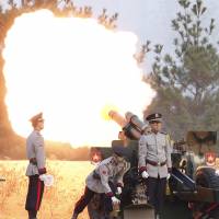 South Korean soldiers fire gun salutes during the honor guard ceremony for the Seoul International Aerospace and Defense Exhibition 2015 at the Defense Ministry in Seoul on Oct. 20. | AP