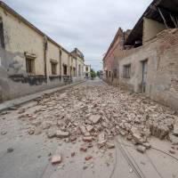 The debris of collapsed houses litters a street in El Galpon on Saturday after a magnitude-5.9 earthquake struck northwest Argentina on Saturday. | REUTERS