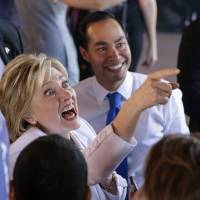 Democratic presidential candidate Hillary Rodham Clinton (left) and Housing and Urban Development Secretary Julian Castro (right) greet supporters during a campaign event on Thursday in San Antonio, Texas. | AP