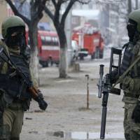 Russian special force soldiers wear masks during an anti-terrorist operation in January 2014 in Makhachkala, regional capital of Dagestan, Russia. The Russian province of Dagestan, a flashpoint for Islamic violence in the North Caucasus, is feeding hundreds of fighters to the Islamic State in Syria, officials say, and now some are coming back home with experience gained from the battlefield. Russia's impoverished Dagestan fertile ground as Islamic State wages recruitment spree