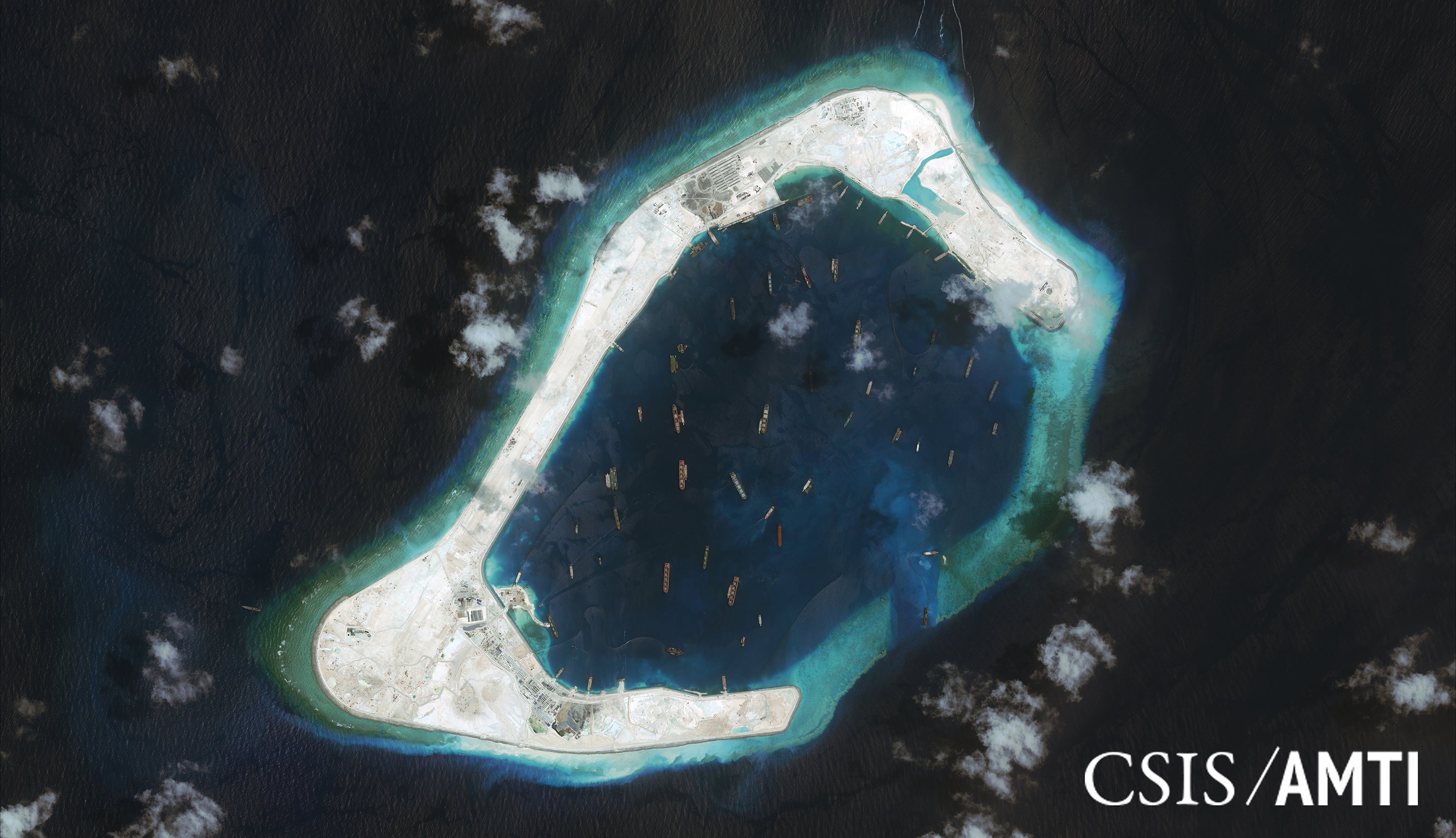 Subi reef, located in the disputed Spratly Islands in the South China Sea, is shown in this handout Center for Strategic and International Studies (CSIS) Asia Maritime Transparency Initiative satellite image taken Sept. 3 and released to Reuters Tuesday. | REUTERS / CSIS ASIA MARITIME TRANSPARENCY INITIATIVE / DIGITALGLOBE / HANDOUT VIA REUTERS