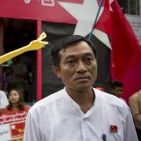 National League for Democracy candidate Win Min campaigns in Yangon on Oct. 6. | REUTERS