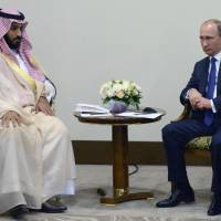 Russian President Vladimir Putin and Saudi\'s Second Deputy Prime Minister and Minister of Defense and Deputy Crown Prince Mohammed bin Salman bin Abdulaziz Al Saud pose for the media after the Formula One Russian Grand Prix at the Sochi Autodrom, in Sochi, Russia, Sunday. | ALEXEI NIKOLSKY, RIA-NOVOSTI, KREMLIN POOL PHOTO VIA AP