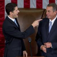 U.S. House Speaker-elect Paul Ryan, a Republican from Wisconsin, gestures toward U.S. House Speaker John Boehner, a Republican from Ohio, after Ryan won the vote during a House Speaker election at the U.S. Capitol in Washington, D.C., U.S., on Thursday. Splintered Republican ranks manage to elect Ryan as House speaker