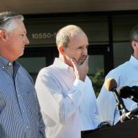 Phil Greene (left), president and CEO TOTE Services, Tim Nolan (right), president of TOTE Maritime Puerto Rico, listen as Anthony Chiarello, President | WILL DICKEY/THE FLORIDA TIMES-UNION VIA AP