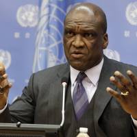 Ambassador John Ashe, of Antigua and Barbuda, the president of the General Assembly 68th session, speaks during a Sept. 17, 2013, news conference at United Nations headquarters. Ashe accepted more than $500,000 in bribes from a Chinese real estate mogul and other businesspeople in exchange for help obtaining lucrative investments and government contracts, according to federal court documents unsealed Tuesday. Ex-U.N. General Assembly head held in bribe probe tied to China billionaire: Ban 'shocked'