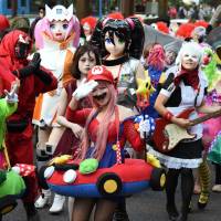Virtual icons come to life at the Kawasaki Halloween parade on Sunday, a warm-up for the real celebration on Halloween.  | SATOKO KAWASAKI