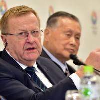 International Olympic Committee Vice President John Coates (left) answers a question as Tokyo 2020 Olympic Games Organizing Committee President Yoshiro Mori looks on during a joint press conference after a two-day review mission in Tokyo on Wednesday. | AFP-JIJI
