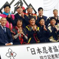 Regional government officials dressed in ninja attire pose for a photo Friday at the launch of a nationwide organization to promote ninja culture. | KYODO