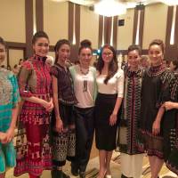 Guests at the reception party after the Fukuoka Prize ceremony are flanked by Vietnamese models in dresses designed by winner Minh Hanh, including two former Miss Vietnam winners (left and third from left). | HANS KARLSSON