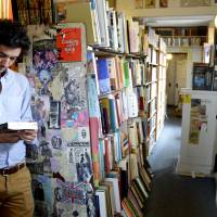 Paper trail: Marco Cremasco of Sao Paulo, Brazil, browses Downtown Books located on the iconic Route 66 in Albuquerque, New Mexico. Used bookstores help tell stories along Route 66