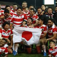 Multicultural maul: The Brave Blossoms celebrate after beating the USA in the Rugby World Cup in England on Oct. 11. Could the talented national team serve as a model or template for a multicultural Japan of the future? | REUTERS