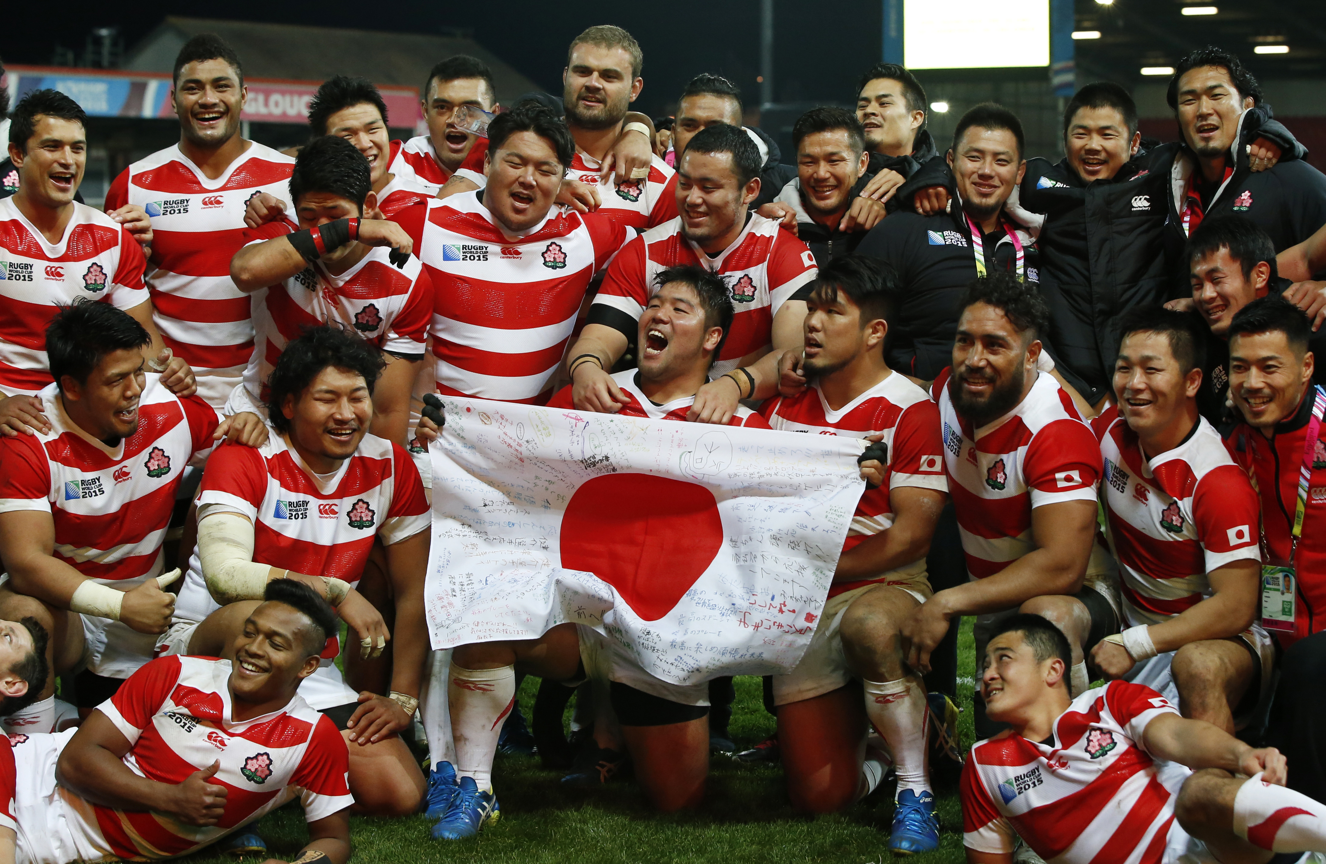 Multicultural maul: The Brave Blossoms celebrate after beating the USA in the Rugby World Cup in England on Oct. 11. Could the talented national team serve as a model or template for a multicultural Japan of the future? | REUTERS