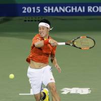Kei Nishikori hits a return to Kevin Anderson at the Shanghai Masters on Thursday. Anderson defeated Nishikori in the third round, winning 7-6 (12-10), 7-6 (7-3). | KYODO