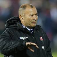 Japan coach Eddie Jones talks to his players ahead of Sunday\'s Rugby World Cup win over the United States in Gloucester, England. | REUTERS