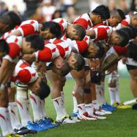 Japan takes a bow after their 26-5 victory over Samoa on Saturday. | REUTERS