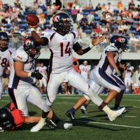 Nojima Sagamihara Rise quarterback Benjamin Anderson passes against the Fujitsu Frontiers during an X League game at Fujitsu Stadium in Kawasaki earlier this month. | KAZ NAGATSUKA