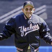 Former Yankees manager and catching great Yogi Bera, seen in a file photo from 2000, displayed common decency and treated people kindly throughout his one-of-a-kind life. | REUTERS