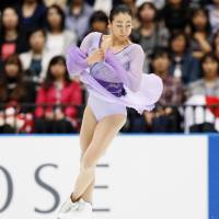 Mao Asada performs a jump during the Japan Open on Saturday. | KYODO