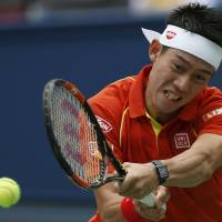 Kei Nishikori hits a shot during his match against Nick Kyrgios of Australia at the Shanghai Masters on Wednesday. | REUTERS