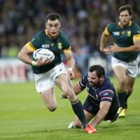 South Africa\'s Jesse Kriel runs with the ball against the United States during their World Cup Pool B match on Wednesday at Olympic Stadium in London. | AP