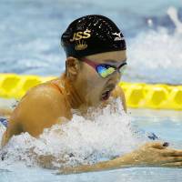 Kanako Watanabe competes in the women\'s 200-meter breaststroke race on Thursday at Tokyo Tatsumi International Swimming Center. Watanabe placed second with a time of 2 minutes, 23.43 seconds. | KYODO