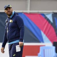 Australia head coach Michael Cheika conducts a training session in Teddington, southwest London, on Tuesday before the Wallabies\' Rugby World Cup semifinal match against Argentina on Sunday. | AFP-JIJI